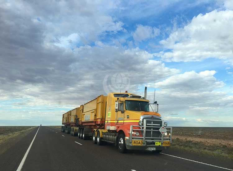 Yellow truck on a highway road