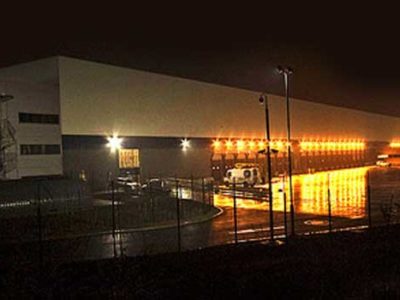 White Logistics Building at night