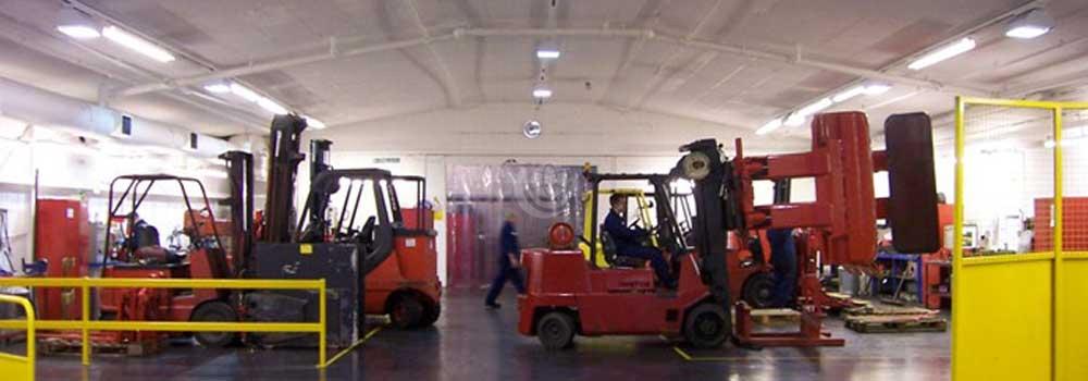 red fork lift trucks in a warehouse