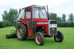 red tractor with gang mower