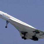 British Airways Concorde flying in blue sky