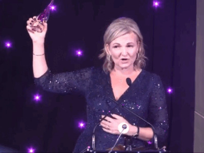 Helen Tonks Winner of Enterprise Vision Awards Internet Industry Award holding her trophy