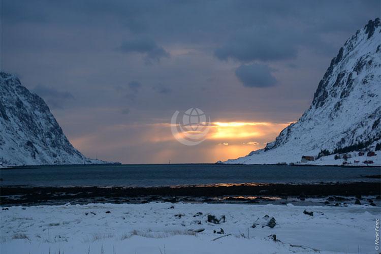 Arctic Sunset between two icebergs