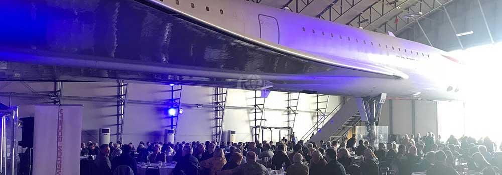 Event under the wings of Concorde G-BOAC at Manchester Airport hangar