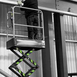 man standing on pop-up tower lift