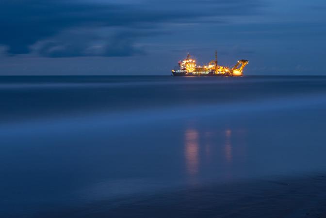 Undersea cable laying boat at night. Marine and Subsea Hydraulics case study
